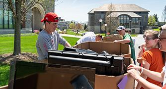 Photo of students recycling electronics